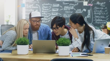 Poster - Diverse Team of Young Developers Have Team Meeting Using Laptop. Beautiful Young People in Bright Modern Office Environment. Shot on RED EPIC-W 8K Helium Cinema Camera.