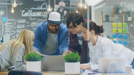 Poster - Diverse Team of Young Women and Men Developers Have Team Meeting Using Laptop. Beautiful Young People in Bright Modern Office Environment. Shot on RED EPIC-W 8K Helium Cinema Camera.