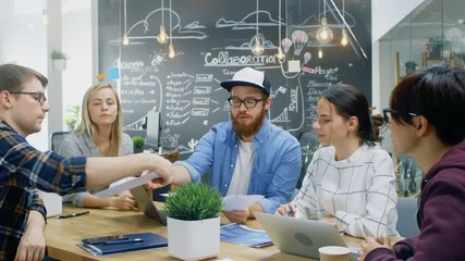 Poster - Team Leader Shows Documents and Paperwork to a Group of Talented Young Developers, They Start Discussion at the Meeting Table. Creative People in Stylish Office Environment. 