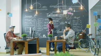 Poster - Creative Male and Female Developers Walk out of the Office while Talking. In the Background Talented Young People Working on Personal Computers. Shot on RED EPIC-W 8K Helium Cinema Camera.