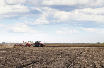 Poster - Modern tractor handles the field