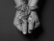 Male hands bound with rope