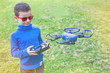 © Michael - a kid using a drone controller to navigate a drone