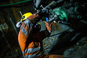 Wall Mural - Miner fixing machine