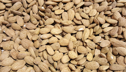 Poster - Pile of almonds close-up as background