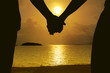 Couple holding hands and beautiful sunset on the River in background. Love, Valentine and Travel concept