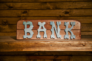 Old Bank sign on side of a building