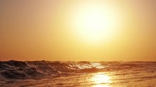 Dramatic Orange Sunrise Over The Beach With Splashing Sea Waves In Slow Motion. 1920x1080