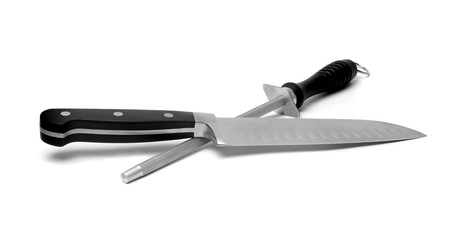 Black kitchen knife and sharpener on the white