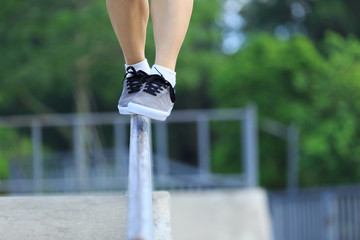 Wall Mural - legs walking on steel pipe with balance