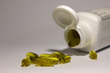 Fototapeta  - Fish oil capsule white background, health care and medical concept
