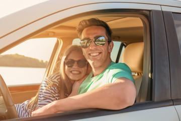 Sticker - Beautiful young couple in car