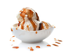 Bowl With Ice Cream And Caramel Sauce On White Background