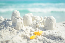 Sandcastle And Shovel On Florida Beach With White Sand
