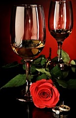 Valentines day with red rose and wine on the table