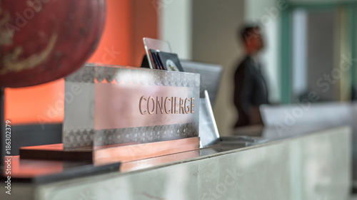 Fotografía Concierge service desk counter with hotel staff team working in front of recepti