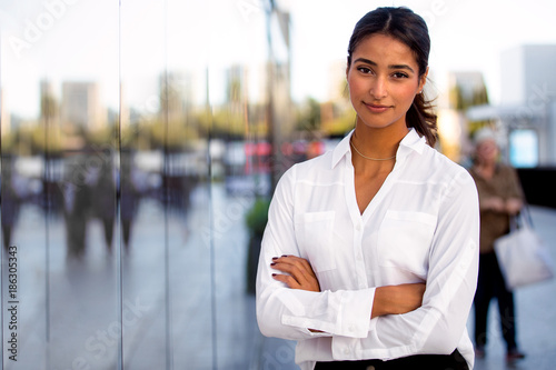 Fotografie, Obraz Serious career motivated successful female business professional standing proud