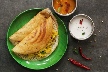 Wall Mural - Dosa - South Indian Breakfast crepes served with chutney and sambar, top view