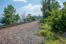 Railroad Tracks On The Edge Of Lake Champlain