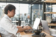 © 88studio - student using computer for learning leasson online at cafe. startup man working with laptop at office.  young male entrepreneur analyze financial data at workplace. business, education concept