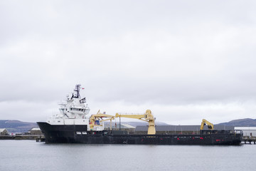 Wall Mural - One large ship carrier at dockyard waiting for containers to be loaded