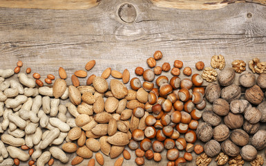 Canvas Print - Variety nuts on old wood