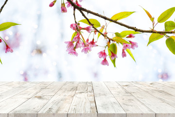 Wall Mural - top of wood table empty ready for your product and food display or montage with pink cherry blossom 