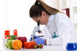 © didesign - Cheking food quality at professional lab with microscope