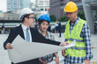 © paulfourk - engineering construction teamwork concept : professional engineer work industrial project site