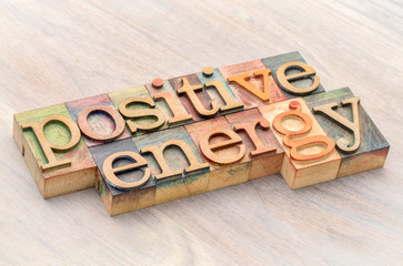 positive energy word abstract in wood type