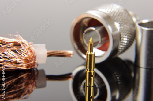 Cuadros en Lienzo Coaxial cable connector assembly accessories isolated on the black reflecting ba