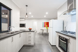 Fototapeta  - Kitchen and dining area in modern Australian home with colourful decor.