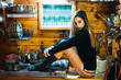 © Kike Arnaiz/ADDICTIVE STOCK - Provocative woman posing on kitchen counter