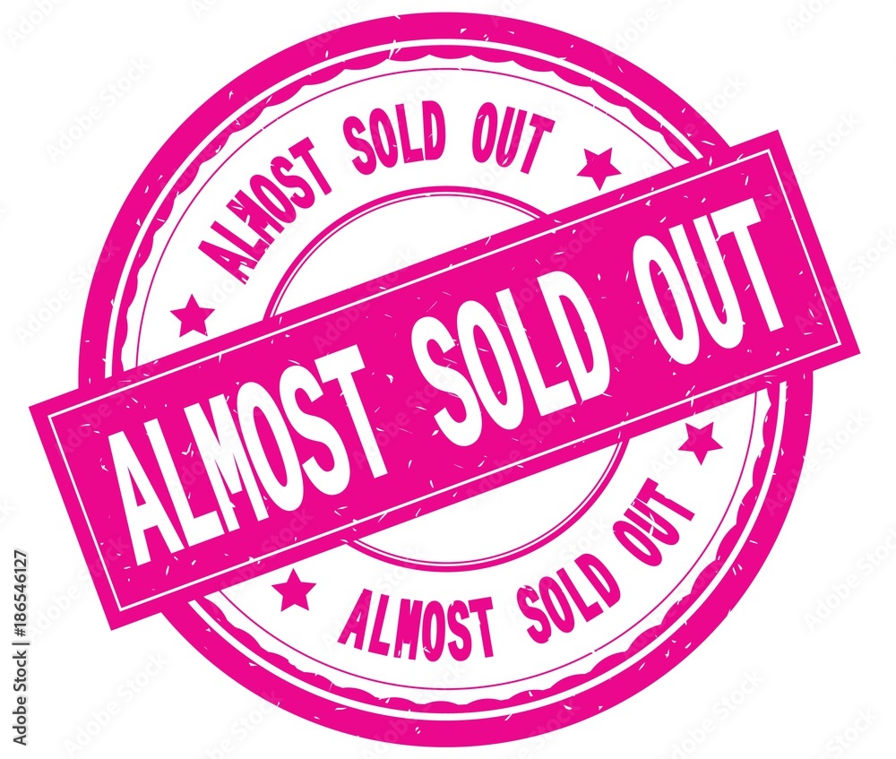 ALMOST SOLD OUT , written text on pink round rubber stamp. Stock  