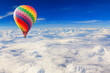Hot air balloon over the white cloud on blue sky