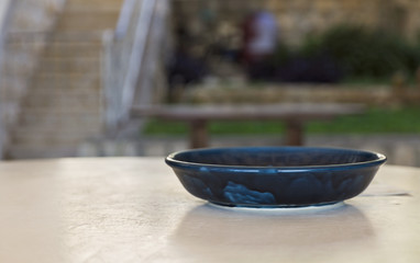 clay dish on the stone table