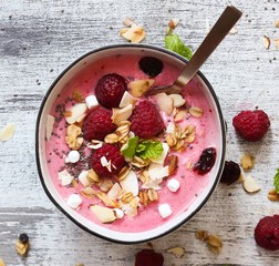 Wall Mural - Raspberry Smoothie Bowl / Healthy breakfast concept, selective focus