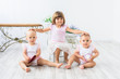 © Nestyda - pretty three girls at home - three sisters are playing together