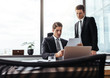 © Jacob Lund - Corporate professionals over viewing documents