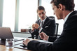 © Jacob Lund - Business people discussing work in office