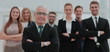 © ASDF - Group portrait of a professional business team looking confident