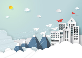 Wall Mural - paper airplanes flying to red flag on the top of buildings,mountains and clouds.paper art style of s