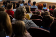 © Andrey Lapshin - People, parents with children in the audience watching a children's show. Sold out. Shooting from the back.