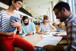 © NDABCREATIVITY - Group of college students studying
