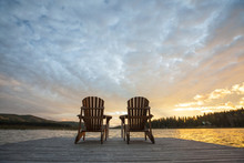 Chairs On Pier By Lac Le Jeune Lake At Paul Lake Provincial Park During Sunset