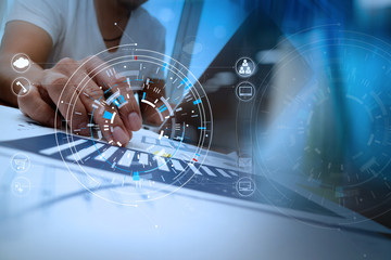 Poster - businessman hand working with modern laptop computer in modern office with virtual icon diagram