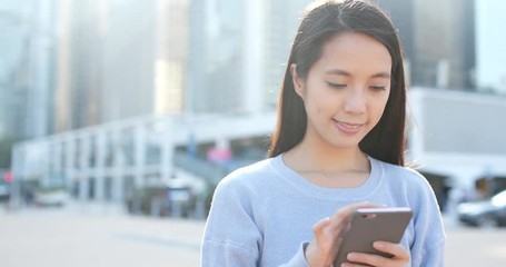 Poster - Woman look at cellphone at outdoor