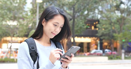 Wall Mural - Woman use of smart phone in city