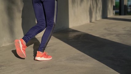 Wall Mural - sportswoman tying shoelaces and keep running