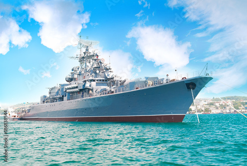 Fotografia Military navy ship in the bay with blue sky and clouds